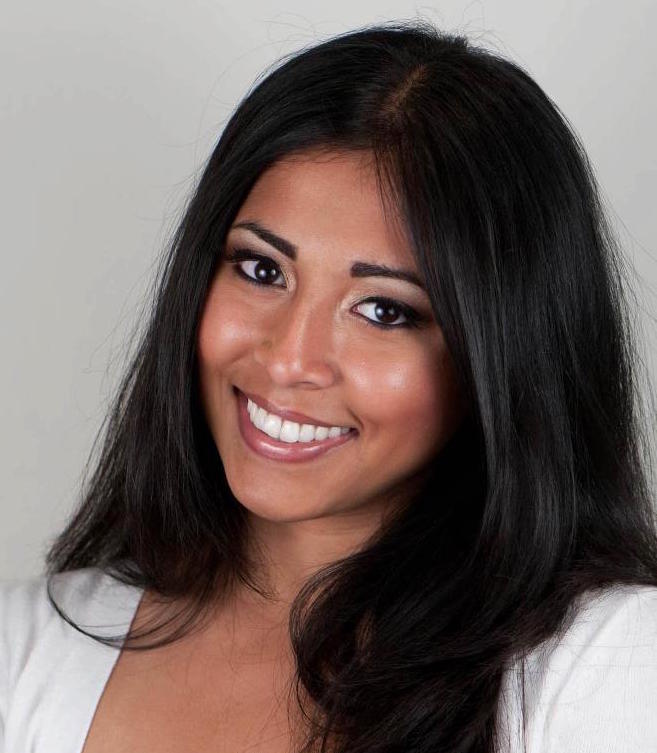 a head shot of Nadia Hussain in front of an off-white background