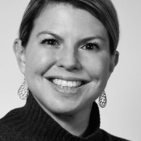 Black and white headshot of Laura Matos wearing black turtleneck
