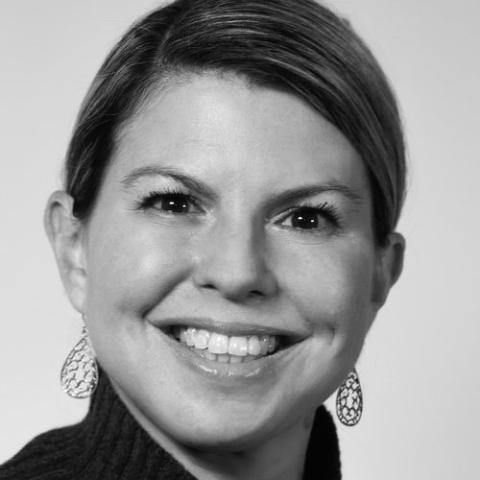 Black and white headshot of Laura Matos wearing black turtleneck