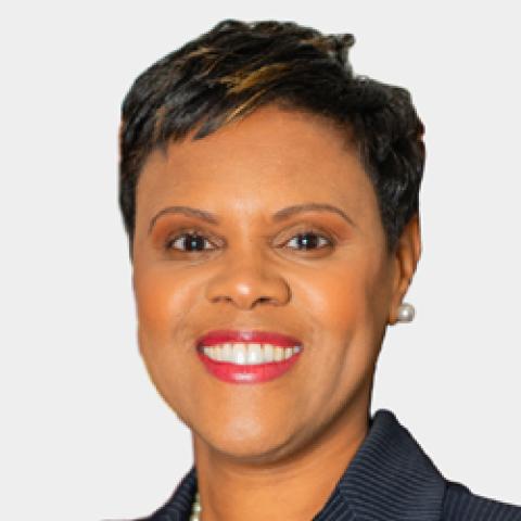 Head shot of Assemblywoman Shavonda Sumter wearing a navy blue jacket against a white background