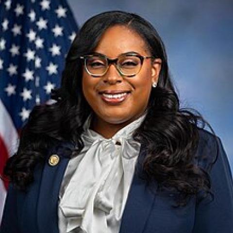 LaMonica McIver in front of an American flag