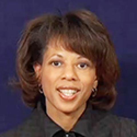 2013 Lipman Chair Melody C. Barnes smiling in front of dark blue background