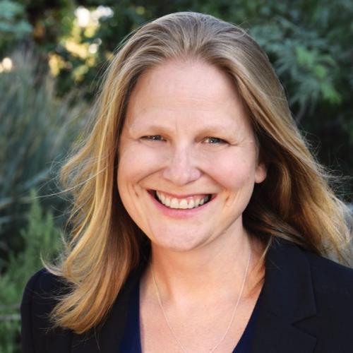 Rachel VanSickle-Ward in a black shirt in front of greenery