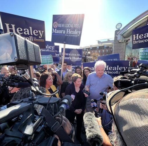 maura healey campaigning for governor surrounded by press