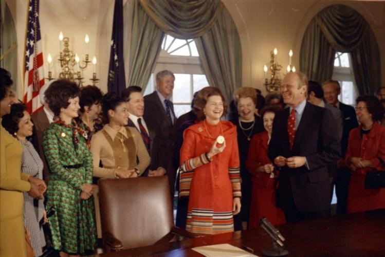 The signing ceremony for the executive order establishing the National Commission for the Observance of International Women's Year