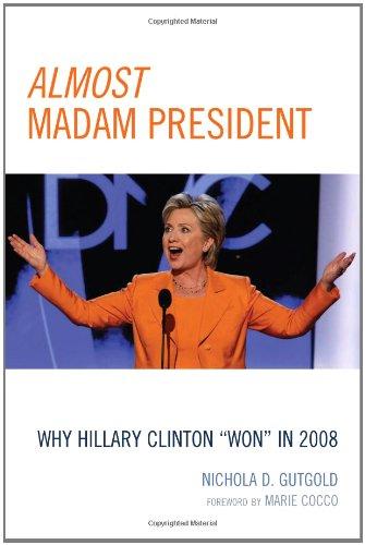 Book cover, Hilary Clinton in orange suit, arms outstretched in front of DNC backdrop