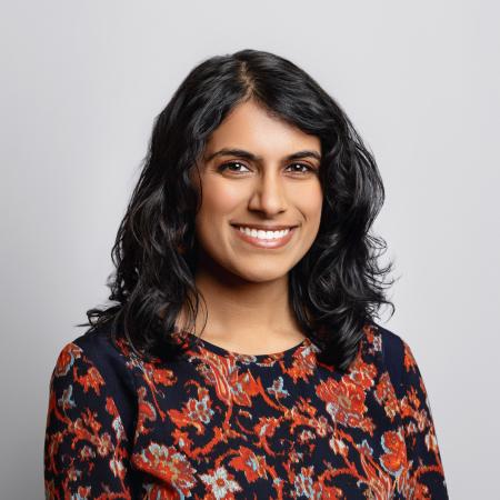 Samyuktha Comandur in patterned blouse in front of neutral background