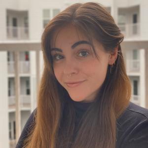 Kaleigh Ruiz smiling in front of blurred background