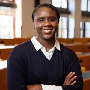 Jamil Scott in a black sweater indoor in front of windows